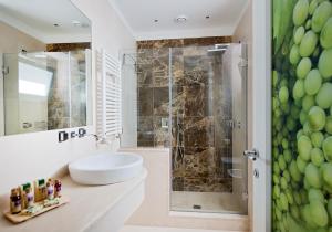 a bathroom with a sink and a shower at Capri Wine Hotel in Capri