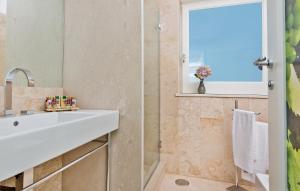 a bathroom with a sink and a shower at Capri Wine Hotel in Capri