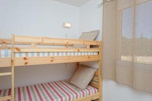 Ένα ή περισσότερα κρεβάτια σε δωμάτιο στο Résidence de Tourisme Mare e Macchia +48 φωτογραφίες