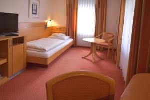 Postel nebo postele na pokoji v ubytování Hotel - Restaurant Hirsch