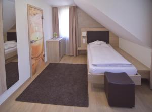 Postel nebo postele na pokoji v ubytování Hotel - Restaurant Hirsch