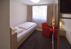 Postel nebo postele na pokoji v ubytování Hotel - Restaurant Hirsch