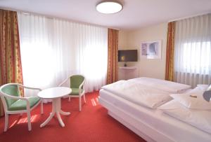 Postel nebo postele na pokoji v ubytování Hotel - Restaurant Hirsch