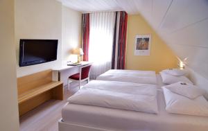 Postel nebo postele na pokoji v ubytování Hotel - Restaurant Hirsch