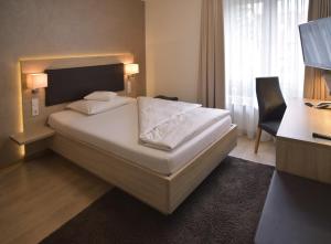 Postel nebo postele na pokoji v ubytování Hotel - Restaurant Hirsch
