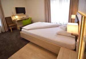 Postel nebo postele na pokoji v ubytování Hotel - Restaurant Hirsch