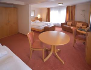 Postel nebo postele na pokoji v ubytování Hotel - Restaurant Hirsch