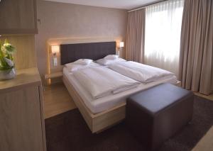 Postel nebo postele na pokoji v ubytování Hotel - Restaurant Hirsch