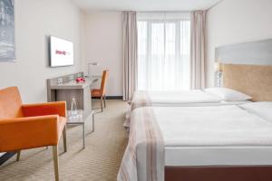 Postel nebo postele na pokoji v ubytování IntercityHotel Dresden
