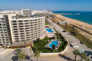 an aerial view of a hotel and the beach at Vila Gale Ampalius in Vilamoura