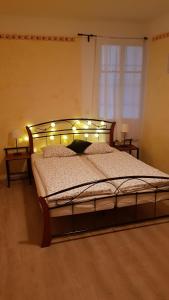 Postel nebo postele na pokoji v ubytování Apartman Lotos