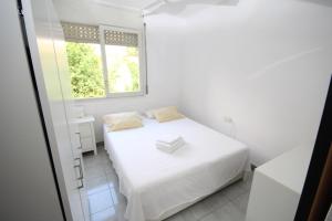 Postel nebo postele na pokoji v ubytování casa en Masnou junto a playa y tren