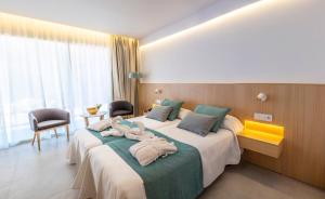 Llit o llits en una habitació de Gran Sagitario