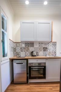 A kitchen or kitchenette at Levkosh Apartments at Lefkada's Heart