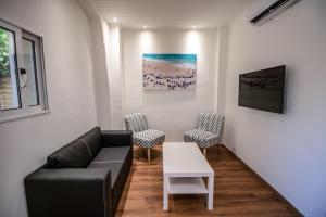 A seating area at Levkosh Apartments at Lefkada's Heart