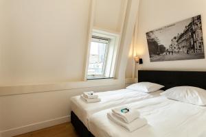 מיטה או מיטות בחדר ב-Stayci Serviced Apartments Central Station