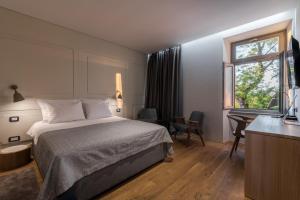 Ένα ή περισσότερα κρεβάτια σε δωμάτιο στο Hotel Peteani
