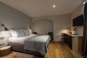 Ένα ή περισσότερα κρεβάτια σε δωμάτιο στο Hotel Peteani