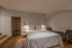 Ένα ή περισσότερα κρεβάτια σε δωμάτιο στο Hotel Peteani