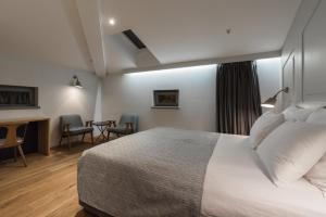 Ένα ή περισσότερα κρεβάτια σε δωμάτιο στο Hotel Peteani