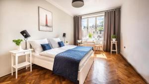 Posteľ alebo postele v izbe v ubytovaní Fenna Apartments 7 minut od Rynku