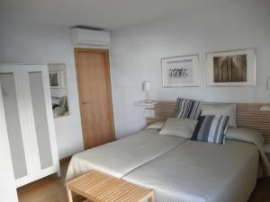 Postel nebo postele na pokoji v ubytování Dormavalencia Hostel