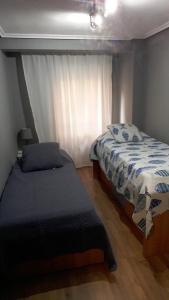 Postel nebo postele na pokoji v ubytování Apartamento Bianca