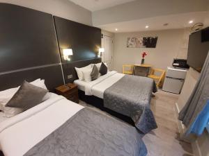 Postel nebo postele na pokoji v ubytování W6 Hotel
