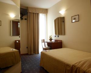 Postel nebo postele na pokoji v ubytování Hotel San Clemente + 37 fotografií