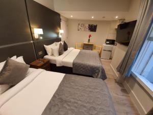 Postel nebo postele na pokoji v ubytování W6 Hotel