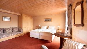 Säng eller sängar i ett rum på Hotel Suisse
