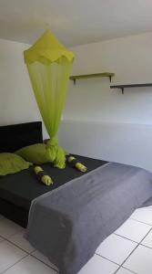 Krevet ili kreveti u jedinici u okviru objekta Les Kaz de Guadeloupe