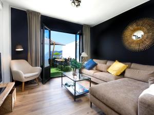 a living room with a couch and a table at Holiday Home Creativo by Interhome in La Herradura