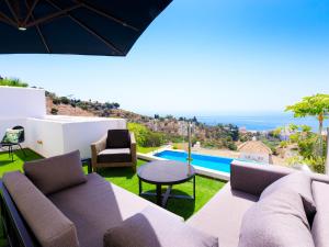 a living room with a couch and a table at Holiday Home Creativo by Interhome in La Herradura