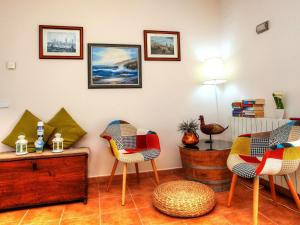 a living room with chairs and a table at Holiday Home Gloria by Interhome in Calonge