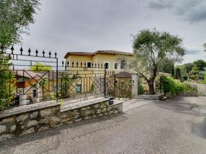 a gate in front of a house at Villa Caliopa by Interhome in Grasse +16 photos