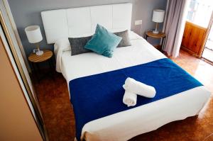 Postel nebo postele na pokoji v ubytování Nest Style Granada