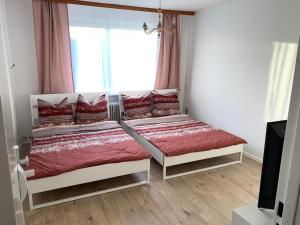 Кровать или кровати в номере Neuköllner Szenekiez - Privatzimmer KREUZBERG RED