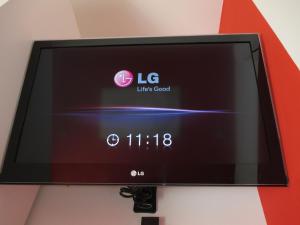 a flat screen tv hanging on a wall at Madrid City Rooms in Madrid +36 photos