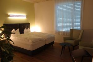 Postel nebo postele na pokoji v ubytování Partner Hotel AG Zofingen