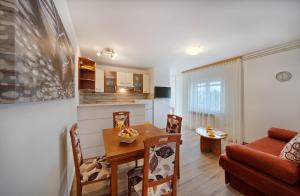 TV a/nebo společenská místnost v ubytování Apartmani MARINA