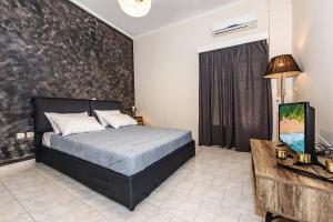 Postel nebo postele na pokoji v ubytování Platanias Villa Spyros