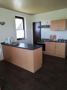 a kitchen with a counter top in a room at Ferienhaus Edeltraud in Dargen