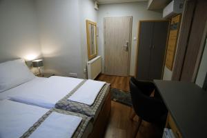 Postel nebo postele na pokoji v ubytování Dolce Vita Panzió