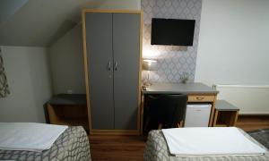 Postel nebo postele na pokoji v ubytování Dolce Vita Panzió