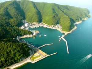 an aerial view of a small island in the water at Fukumakan in Matsue