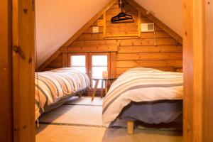 Ένα ή περισσότερα κρεβάτια σε δωμάτιο στο Hirafu Powder Cottage / Vacation STAY 4997