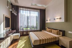 Postel nebo postele na pokoji v ubytování SunRay Resort&Spa + 37 fotografií