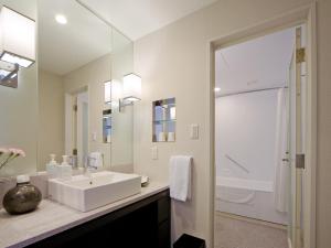 a bathroom with a sink and a mirror at Hotel Nikko Kanazawa in Kanazawa