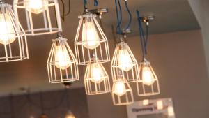 a bunch of lights hanging from a ceiling at Holiday Inn Express Aberdeen Airport by IHG in Dyce